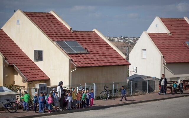 Young children cross the road in the West Bank outpost of Shvut Rachel, November 17, 2016 (Miriam Alster/ Flash90/ File) Young children cross the road in the West Bank outpost of Shvut Rachel, November 17, 2016 (Miriam Alster/ Flash90/ File)