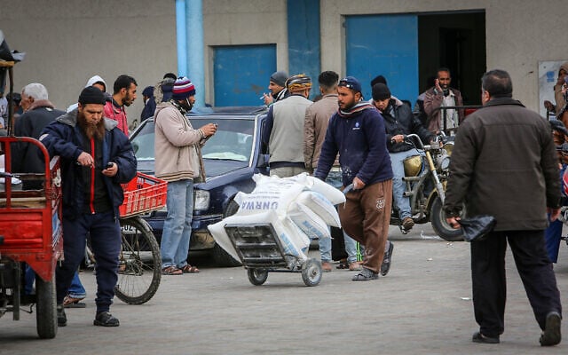 Palestinians receive food aid at a United Nations distribution center (UNRWA) in the southern Gaza Strip town of Rafah, on January 13, 2020. (Abed Rahim Khatib/ Flash90/ File) Palestinians receive food aid at a United Nations distribution center (UNRWA) in the southern Gaza Strip town of Rafah, on January 13, 2020. (Abed Rahim Khatib/ Flash90/ File)