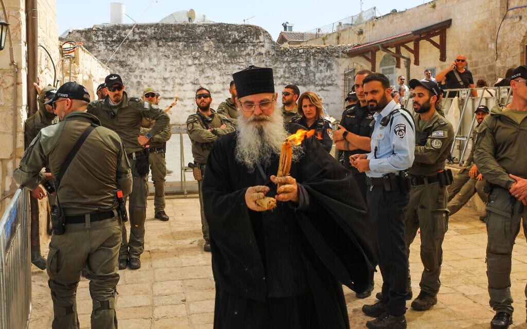 Christian worshipers at the Church of the Holy Sepulchre in Jerusalem's Old City on May 4, 2024. (Jamal Awad/Flash90) Christian worshipers at the Church of the Holy Sepulchre in Jerusalem's Old City on May 4, 2024. (Jamal Awad/Flash90)