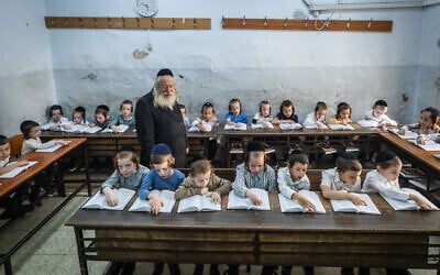 Ultra-Orthodox children in their classroom in Jerusalem's Mea She'arim neighborhood, September 4, 2024. (Chaim Goldberg/Flash90)