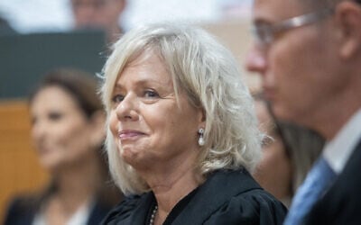 Attorney-General Gali Baharav Miara (center) and Justice Minister Yariv Levin at a farewell ceremony for retiring acting Supreme Court President Uzi Vogelman, at the Supreme Court in Jerusalem on October 1, 2024. (Oren Ben Hakoon/POOL)