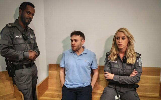 Ari Rosenfeld, one of the suspects in the classified documents leak case, arrives at the Tel Aviv District Court on January 7, 2025. (Koko/Flash90) Ari Rosenfeld, one of the suspects in the classified documents leak case, arrives at the Tel Aviv District Court on January 7, 2025. (Koko/Flash90)