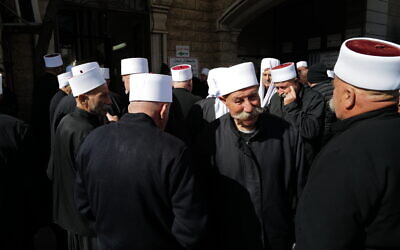 Druze men seen during a funeral in Majdal Shams, February 14, 2025. (Michael Giladi/ Flash90)