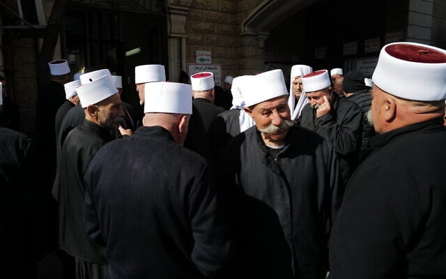 Druze men seen during a funeral in Majdal Shams, February 14, 2025. (Michael Giladi/ Flash90)