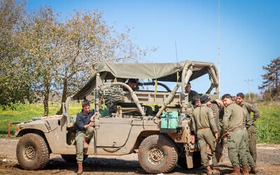 Israeli soldiers rest after leaving southern Lebanon. February 18, 2025. (David Cohen/FLASH90)