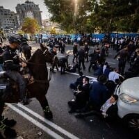 Haredi Jews clash with police during a protest against the ultra-Orthodox draft on Road 4 outside Bnei Brak on March 2, 2025 (Photo by Yonatan Sindel/Flash90)