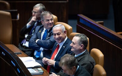 Prime Minister Benjamin Netanyahu sits with cabinet ministers in the Knesset plenum, March 3, 2025. (Chaim Goldberg/Flash90)