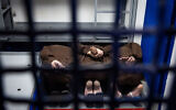 Elite Hamas Nukhba terrorists who were detained after participating in the October 7, 2023, massacre are seen in a jail cell in a prison in central Israel, where high risk Hamas and Hezbollah prisoners captured during the war are being held, March 4, 2025. (Chaim Goldberg/Flash90)