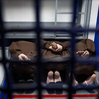 Elite Hamas Nukhba terrorists who were detained after participating in the October 7, 2023, massacre are seen in a jail cell in a prison in central Israel, where high risk Hamas and Hezbollah prisoners captured during the war are being held, March 4, 2025. (Chaim Goldberg/Flash90)