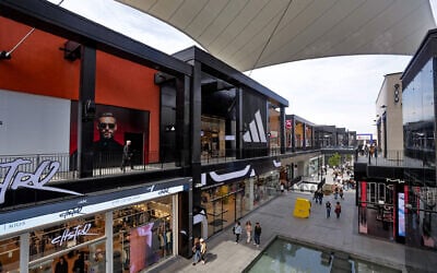 People shop at the at BIG Fashion in Glilot on March 4, 2025. (Tal Gal/Flash90)