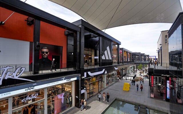 People shop at the at BIG Fashion in Glilot on March 4, 2025. (Tal Gal/Flash90)