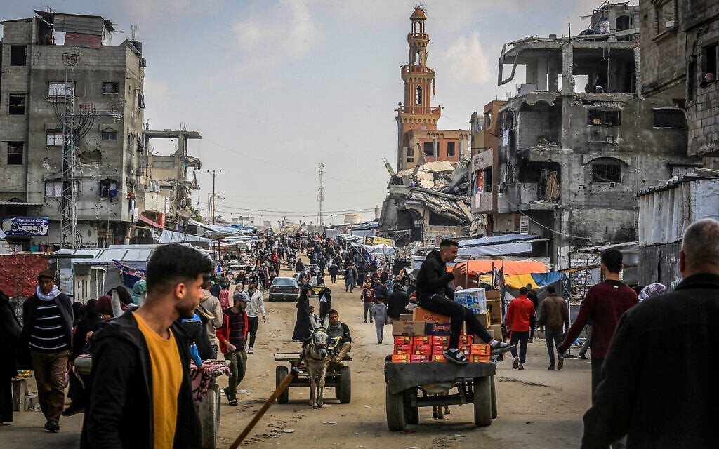 Palestinians shop for food at the market in Khan Younis in the southern Gaza Strip on March 8, 2025. (Abed Rahim Khatib/Flash90)