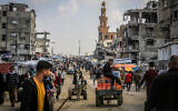 Palestinians shop for food at the market in Khan Younis in the southern Gaza Strip on March 8, 2025. (Abed Rahim Khatib/Flash90)