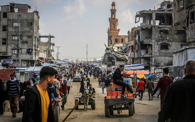Palestinians shop for food at the market in Khan Younis in the southern Gaza Strip on March 8, 2025. (Abed Rahim Khatib/Flash90)