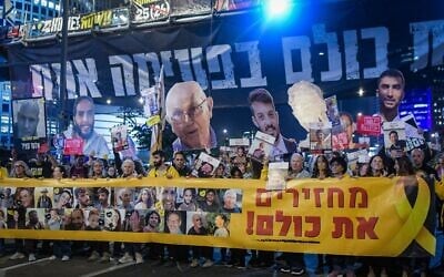 Demonstrators protest for the release of Israelis held hostage in the Gaza Strip, outside the Defense Ministry headquarters, in Tel Aviv, March 11, 2025. (Avshalom Sassoni/Flash90)