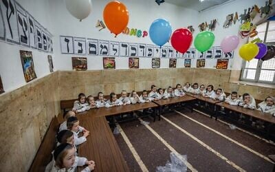 Ultra-Orthodox kids dressed up in costumes at their school, in Mea Shearim, Jerusalem, ahead of the Jewish holiday of Purim, on March 12, 2025. (Chaim Goldberg/Flash90)