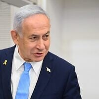 Prime Minister Benjamin Netanyahu arrives at the Tel Aviv Distrcit Court before a hearing in his corruption trial, March 12, 2025. (Yair Sagi/Pool)