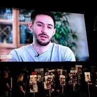 Freed hostage Omer Shem Tov remotely addresses a rally calling for the release of Israelis held captive by Hamas terrorists in Gaza, at Hostages Square in Tel Aviv, March 15, 2025. (Avshalom Sassoni/Flash90)
