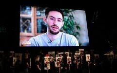 Freed hostage Omer Shem Tov remotely addresses a rally calling for the release of Israelis held captive by Hamas terrorists in Gaza, at Hostages Square in Tel Aviv, March 15, 2025. (Avshalom Sassoni/Flash90)