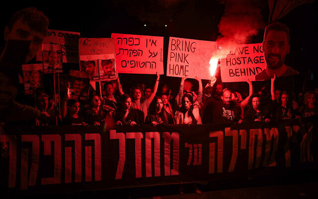 Protesters call for the release of Israelis held hostage in the Gaza Strip, outside Hakirya Base in Tel Aviv, March 15, 2025. (Flash90) Protesters call for the release of Israelis held hostage in the Gaza Strip, outside Hakirya Base in Tel Aviv, March 15, 2025. (Flash90)