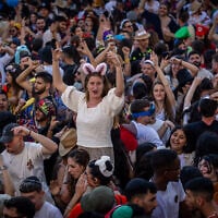 People in costumes party in the Nahlaot neighborhood of Jerusalem, during the Jewish holiday of Purim, on March 16, 2025. (Oren Ben Hakoon/Flash90)