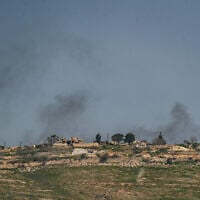 Smoke rises from a village in southern Lebanon, as seen from the Israeli side of the border, on March 17, 2025. (Ayal Margolin/ Flash90)