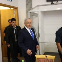 Prime Minister Benjamin Netanyahu arrives at the Distrcit Court in Tel Aviv, before the start of testimony in his trial against him, March 17, 2025 (Tomer Appelbaum/POOL)