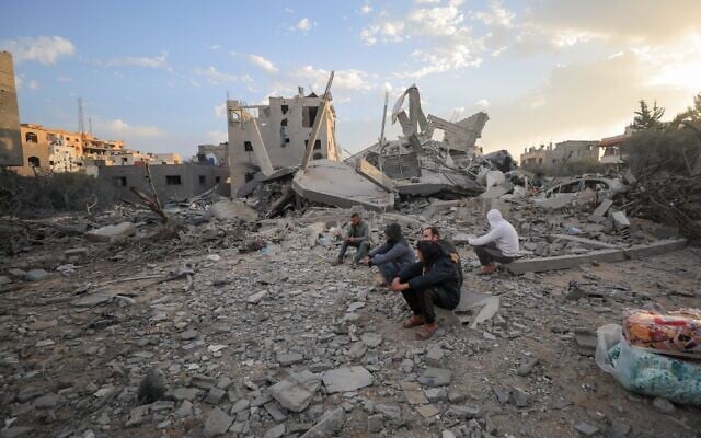 Palestinians at the scene of an Israeli airstrike in Gaza City, on March 18, 2025. (Ali Hassan/Flash90) Palestinians at the scene of an Israeli airstrike in Gaza City, on March 18, 2025. (Ali Hassan/Flash90)