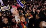 Israelis attend a rally against Prime Minister Benjamin Netanyahu's decision to fire Shin Bet chief Ronen Bar, at Habima Square in Tel Aviv on March 18, 2025. (Tomer Neuberg/Flash90)