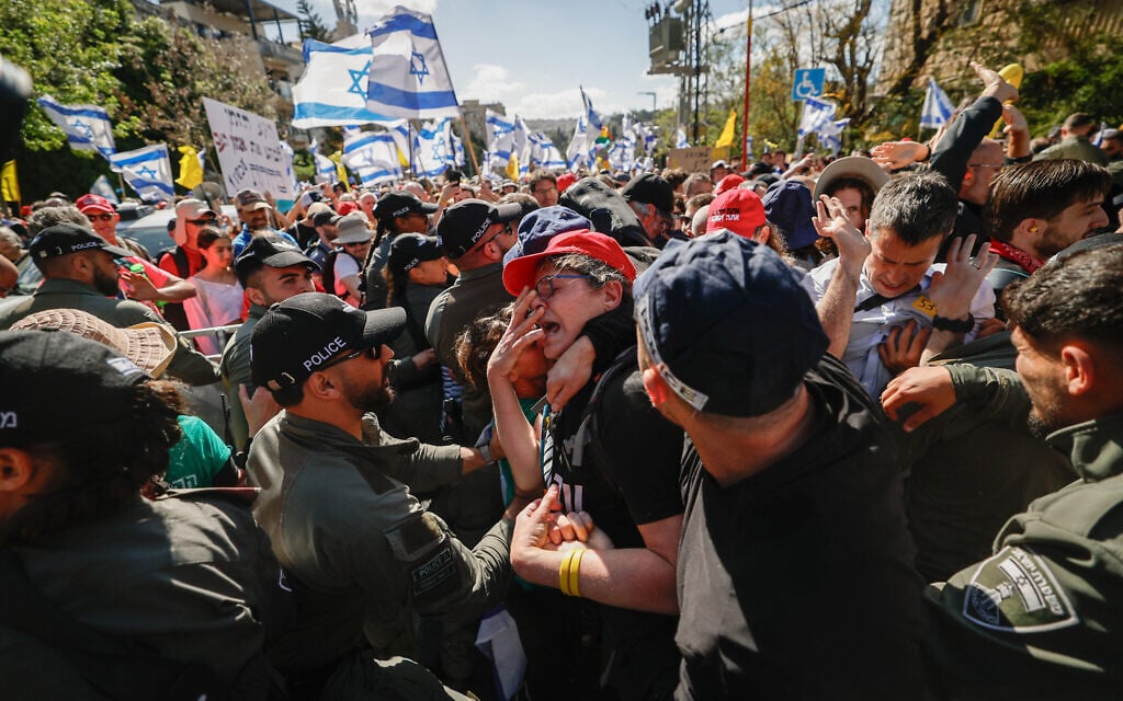 Israelis attending a protest march against the decision of Prime Minister Benjamin Netanyahu to fire head of Shin Bet Ronen Bar, clash with police in Jerusalem, March 19, 2025. (Yonatan Sindel/Flash90) Israelis attending a protest march against the decision of Prime Minister Benjamin Netanyahu to fire head of Shin Bet Ronen Bar, clash with police in Jerusalem, March 19, 2025. (Yonatan Sindel/Flash90)