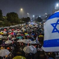 Demonstrators protest against the decision of Prime Minister Benjamin Netanyahu to fire head of Shin Bet Ronen Bar, outside the Prime Minister's Office in Jerusalem, March 20, 2025. (Chaim Goldberg/Flash90)