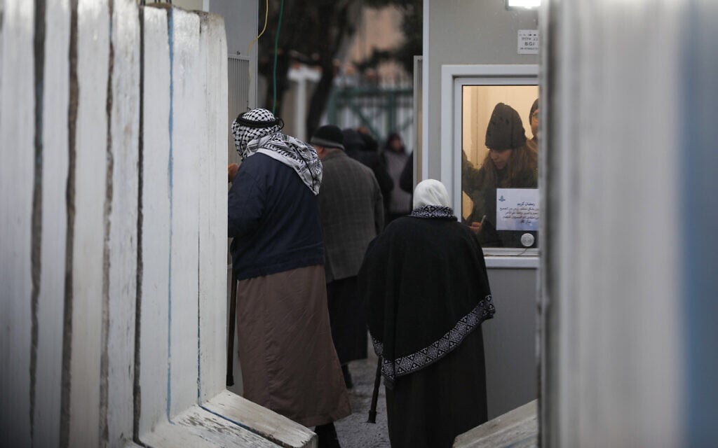Palestinians make their way through an Israeli checkpoint near the West Bank city of Bethlehem, to attend prayers at Al-Aqsa Mosque on the third Friday of Ramadan, March 21, 2025. (Wisam Hashlamoun/Flash90)