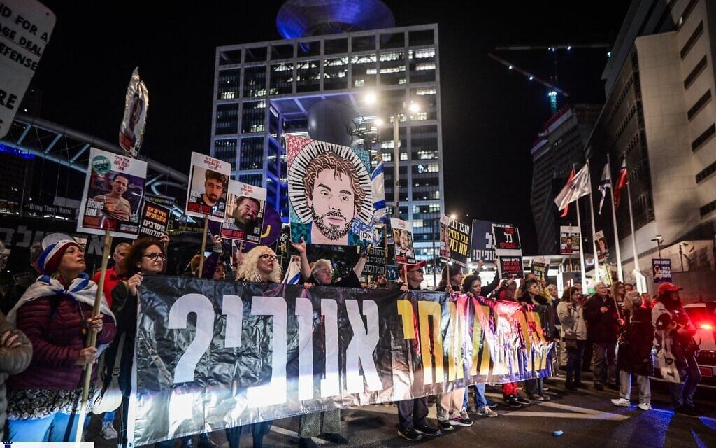 Demonstrators demand the release of Israelis held hostage in the Gaza Strip, outside the Defense Ministry headquarters in Tel Aviv, March 23, 2025. (Avshalom Sassoni/Flash90)