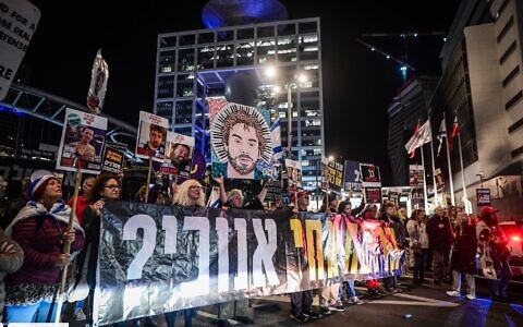 Demonstrators demand the release of Israelis held hostage in the Gaza Strip, outside the Defense Ministry headquarters in Tel Aviv, March 23, 2025. (Avshalom Sassoni/Flash90)