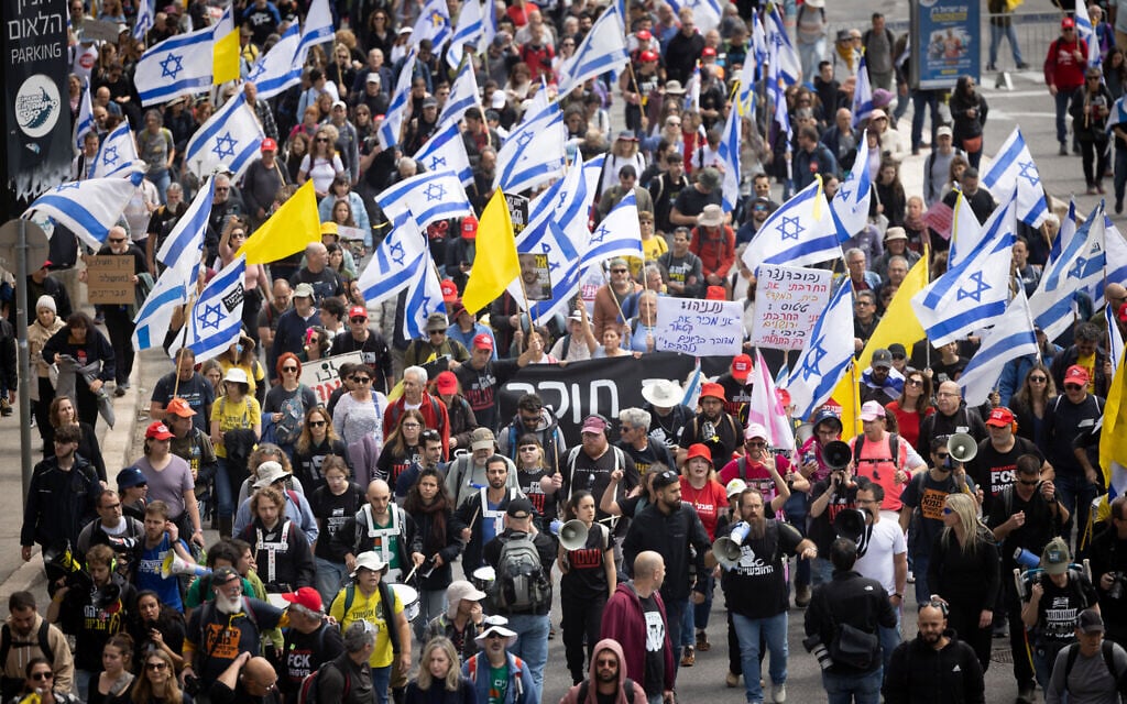Israelis attend a protest march against Israeli prime minister Benjamin Netanyahu and his government, outside the government conference at the PM's office in Jerusalem, March 23, 2025. (Chaim Goldberg/Flash90)