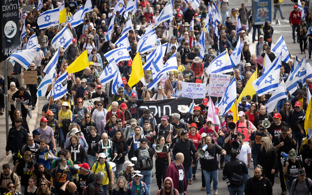 Israelis attend a protest march against Israeli prime minister Benjamin Netanyahu and his government, outside the government conference at the PM's office in Jerusalem, March 23, 2025. (Chaim Goldberg/Flash90)