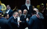 Knesset Finance Committee chair Moshe Gafni (3rd from left) and other ultra-Orthodox lawmakers pictured in the Knesset as the 2025 state budget law is passed, March 25, 2025. (Yonatan Sindel/Flash90)