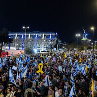 People protest against Prime Minister Benjamin Netanyahu's government, outside the Knesset, in Jerusalem, March 26, 2025. (Chaim Goldberg/Flash90)