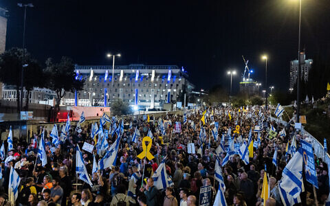 People protest against Prime Minister Benjamin Netanyahu's government, outside the Knesset, in Jerusalem, March 26, 2025. (Chaim Goldberg/Flash90)