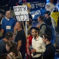 People protest against Prime Minister Benjamin Netanyahu and his government, outside the Knesset, in Jerusalem, March 26, 2025. Poster reads 'Checks and balances.' (Chaim Goldberg/Flash90)