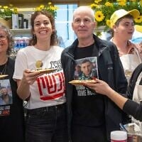 (L-R): Former hostage Aviva Siegel, her daughter Shir and husband, recently released hostage Keith, celebrate the opening of the Keit Siegel Pancake House at Sarona Market in Tel Aviv, March 26, 2025. (Miriam Alster/Flash90)