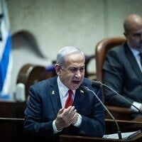 Prime Minister Benjamin Netanyahu speaks during a debate, at the plenum hall of the Knesset in Jerusalem, on March 26, 2025 (Yonatan Sindel/Flash90)