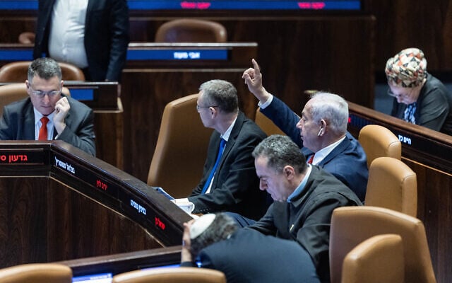 Prime Minister Benjamin Netanyahu and ministers seen at the assembly hall of the Knesset during a vote on a bill to remake Israel's Judicial selection committee, March 27, 2025 (Chaim Goldberg/Flash90) Prime Minister Benjamin Netanyahu and ministers seen at the assembly hall of the Knesset during a vote on a bill to remake Israel's Judicial selection committee, March 27, 2025 (Chaim Goldberg/Flash90)