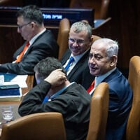 Prime Minister Benjamin Netanyahu, Justice Minister Yariv Levin, and other ministers in the Knesset plenum during a vote on a law to overhaul Israel's judicial selection process, March 27, 2025. (Chaim Goldberg/Flash90)