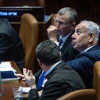 Prime Minister Benjamin Netanyahu and ministers in the Knesset plenum during a vote on a bill to remake Israel's judicial appointments process, March 27, 2025. (Chaim Goldberg/Flash90)