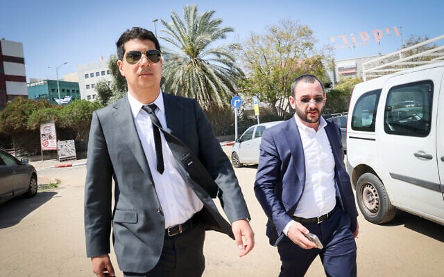 Amit Hadad (L), the lawyer for Prime minister Benjamin Netanyahu and his top aide Jonatan Urich outside the Lahav 433 police unit headquarters, in the city of Lod on March 31, 2025. (Jonathan Shaul/ Flash90) Amit Hadad (L), the lawyer for Prime minister Benjamin Netanyahu and his top aide Jonatan Urich outside the Lahav 433 police unit headquarters, in the city of Lod on March 31, 2025. (Jonathan Shaul/ Flash90)