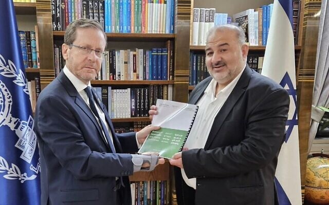 Ra'am chair Mansour Abbas presents his "Bridges of Reconciliation and Peace Initiative" to President Isaac Herzog at the latter's office in Jerusalem on March 20, 2025. (Mansour Abbas/X)