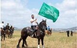 Undated photo of Kafr Kanna resident Jihad Zureiqat waving a Hamas flag (Israel Police)