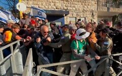 Anti-government protesters clash with police during a protest outside the prime minister's residence in Jerusalem on March 23, 2025. (Charlie Summers/Times of Israel)