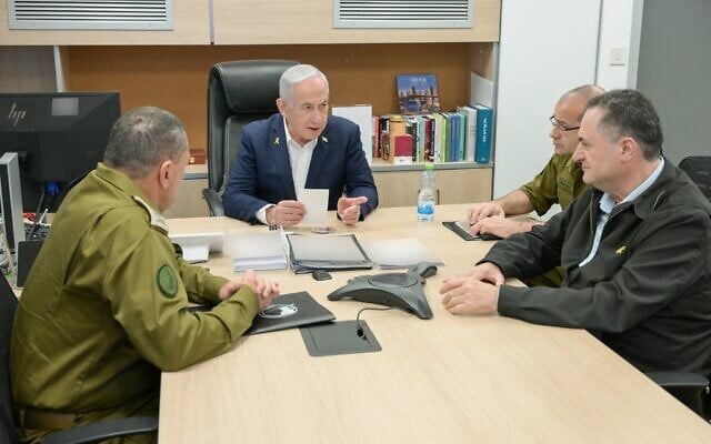 Prime Minister Benjamin Netanyahu (center) holds a situational assessment at the IDF Kirya headquarters in Tel Aviv with IDF Chief of Staff Lt. Gen. Eyal Zamir (left), military secretary Maj. Gen. Roman Gofman (second from right), and Defense Minister Israel Katz (right), March 18, 2025. (Maayan Toaf/GPO)
